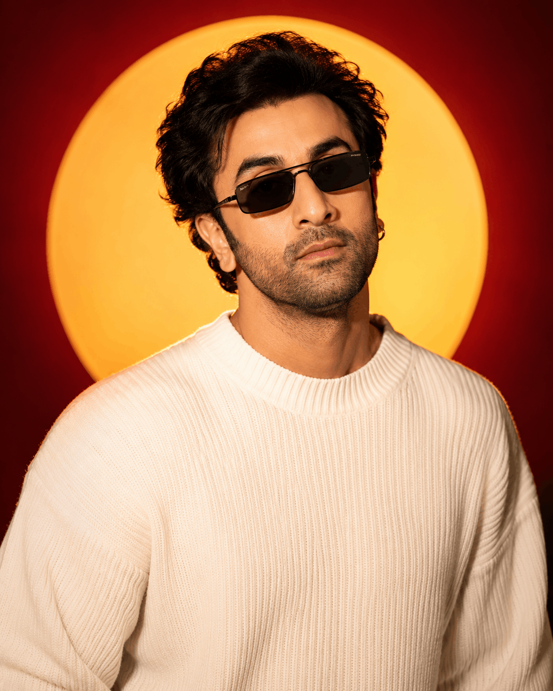Burgundy glow chest-up portrait example Luxury Editorial Studio Profile Photo chest-up portrait with a glowing circular sun disc on a burgundy background